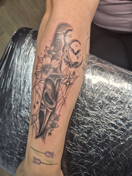 Illustrative tattoo on the forearm