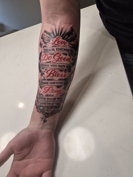 Script tattoo on the forearm