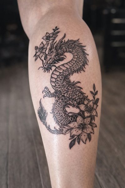 Dragon and florals tattoo